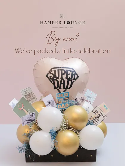 When it's time for a big win, I pack a celebration. This Father's Day hamper is a burst of joy with a "Super Dad" balloon, photos, and fun cards to cheer him on.