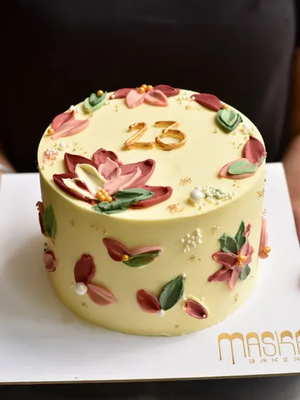 We love being part of your special moments with our custom celebration cakes. This one, with its delicate buttercream flowers, was made for a 23rd birthday. We focus on delicious flavours and natural decorations, never fondant.