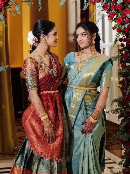 Another beautiful shot of the sisters. The soft lighting highlights the glowing finish of their makeup.