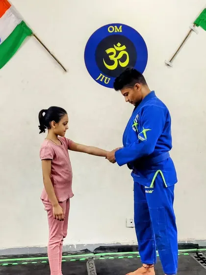 Recognizing the hard work of one of our youngest students. Her focus and commitment have earned her this well-deserved promotion.