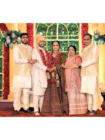 A beautiful family portrait with the bride and groom.