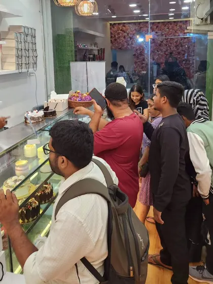 Another shot of the happy crowd during our offer day. I love interacting with my customers and helping them choose the perfect cake for their celebration. Your satisfaction is what drives me.
