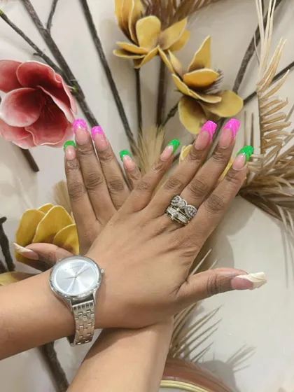 This shot highlights the fun, mismatched color combination of the neon French tips.