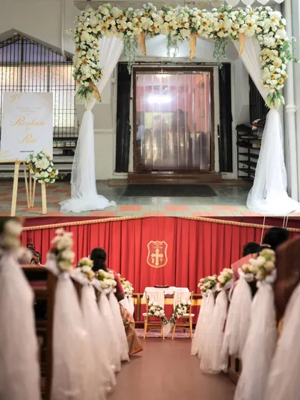 The view from the back of the church, looking down the aisle towards the altar. The floral arch at the entrance and the decorated pews create a beautiful, inviting path for the bride's procession.