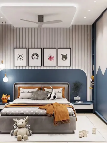 A stylish boy's room with a cool blue color palette, a mountain-themed wardrobe design, and playful wall art.
