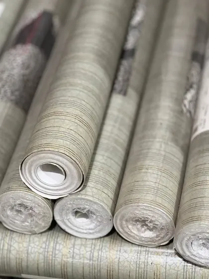 Rolls of textured wallpaper from my collection, featuring a subtle grain and pattern. This is a great option for adding dimension to a wall without overwhelming the space.