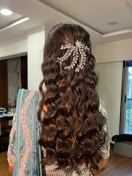 Another view of the voluminous curls, perfect for a glamorous evening event.