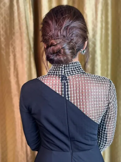 Another angle of the twisted bun, highlighting its smooth finish and elegant shape.