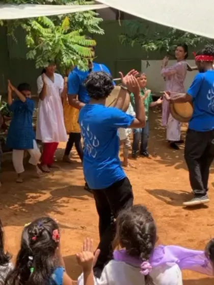 Children and instructors dance together to the beat of the parai drum during our Independence Day celebration, sharing in the joy of folk music and community.