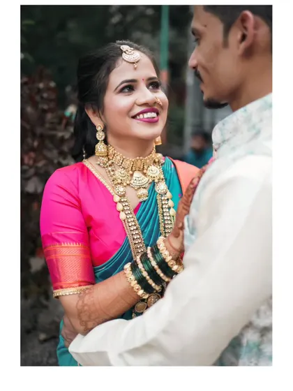 A beautiful candid photo of the bride looking at her partner with love and admiration during their engagement.