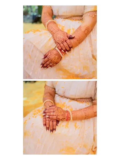 A detail shot of the bride's hands, beautifully adorned with mehndi and lightly stained with haldi.