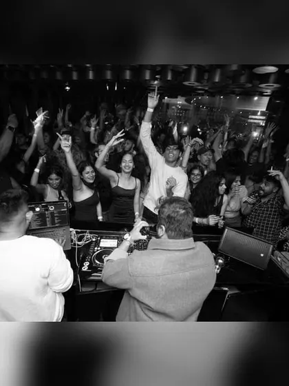 A black and white shot capturing the raw energy of the dance floor from my perspective. Timeless party moments.