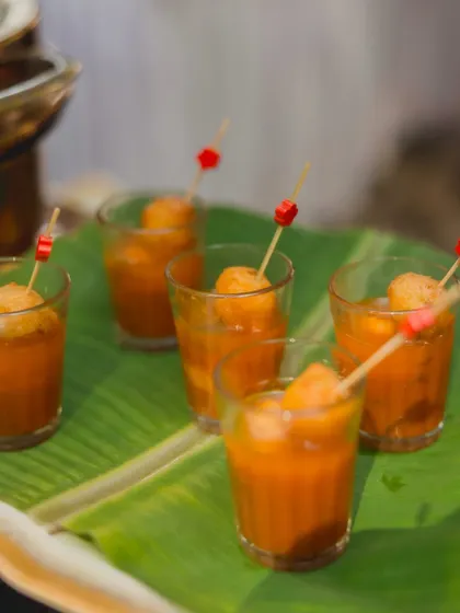 I love serving classics in new ways, like these Rasam Vada shots. A crispy vada is placed atop a shot glass filled with hot and tangy rasam, making it an easy-to-eat and elegant appetizer.