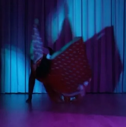 The blur of a spin during a solo practice session. This is where I lose myself in the flow and find new expressions, turning feelings into movement.