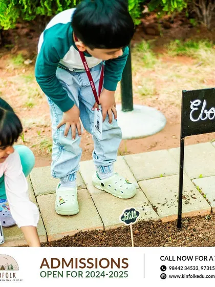 Children exploring our garden, learning about different plants like Ebony and Dill. Open-ended play in nature is the best way for them to explore their world.