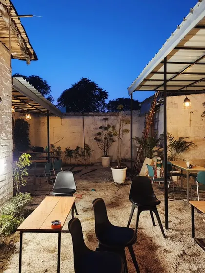 A view of the cafe's outdoor area, showing how we can turn a basic backyard into a charming and functional commercial space.