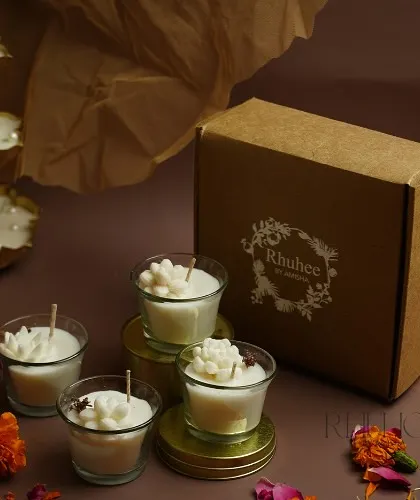 This mini jar candle set, featuring tiny floral-topped candles, comes in a gift-ready box. It's a charming and affordable option for gifting.
