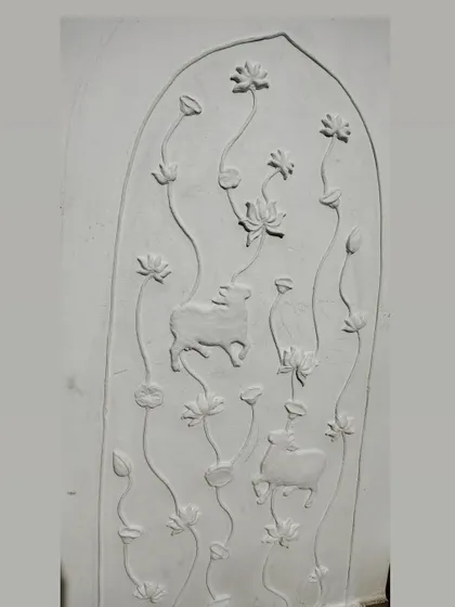 This is how a 3D relief mural looks before the magic of color is added. Just pure, hand-sculpted clay on a panel. You can see the forms of the cows and lotuses taking shape, ready to be brought to life.
