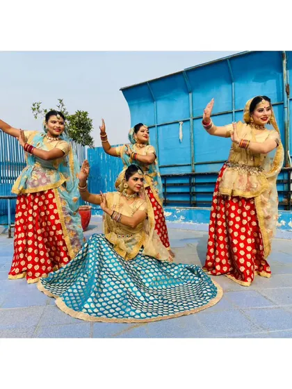 Our folk dance team posing in traditional attire. We provide professional dance troupes for army functions, cultural celebrations, and corporate events, showcasing the beauty of Indian culture.