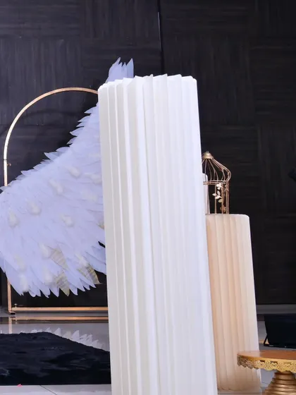 A detail shot of the white fluted plinths used for display, a versatile prop that works well with many different themes.