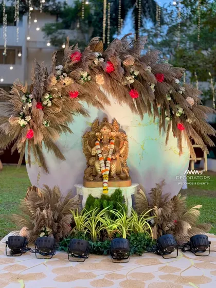The Ganesha installation, a perfect blend of traditional blessings and modern rustic decor with pampas grass and a soft-lit backdrop.
