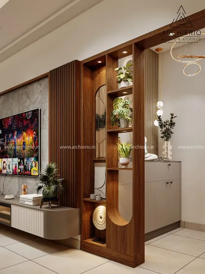 This custom wooden partition with built-in display shelves elegantly separates the living and dining areas while maintaining an open and connected feel.
