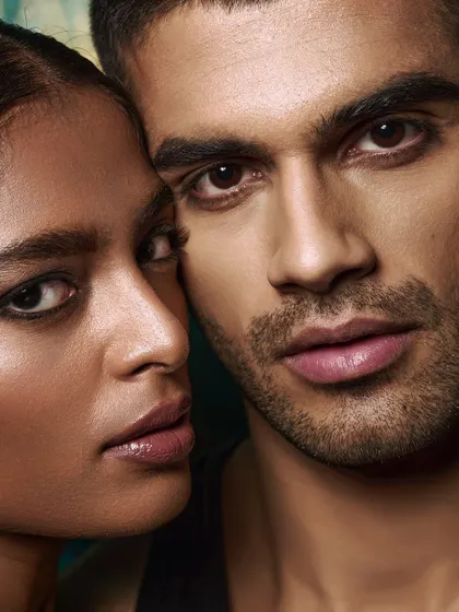 A very tight crop showing the details of the models' faces. This type of shot is crucial for beauty campaigns where every detail matters.