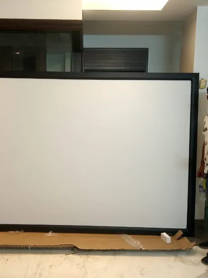 Here I am with a newly assembled fixed-frame projector screen. I am personally involved in every project to ensure every detail is just right, bringing happiness to another home.
