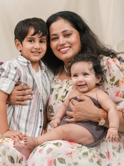 A beautiful portrait of a mother with her two children, capturing a moment of quiet connection and love.