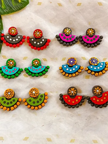 These images display the extensive variety of earrings I create, from jhumkas to studs and danglers, all showcasing different patterns, colors, and shapes ready for bulk orders.