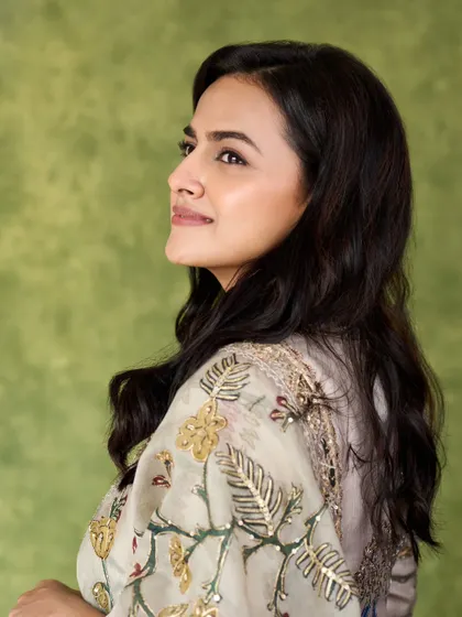 Another angle of Shraddha's floral saree, showing her serene expression. This is a perfect look for an elegant, daytime event.