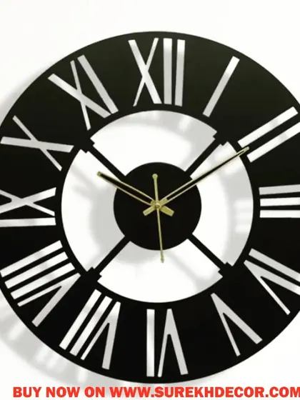 This vintage-inspired wall clock features bold, cutout Roman numerals in a solid black and white design. The high-contrast look is both easy to read and visually striking, making it a great addition to any room.