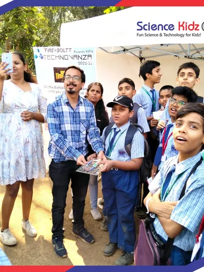 A crowd of enthusiastic school students gathered at our stall during Technovanza, eager to learn about the projects our team had on display.