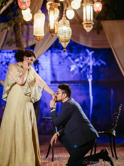 A classic proposal moment. The makeup is glamorous and elegant, making this a truly special and memorable photo.
