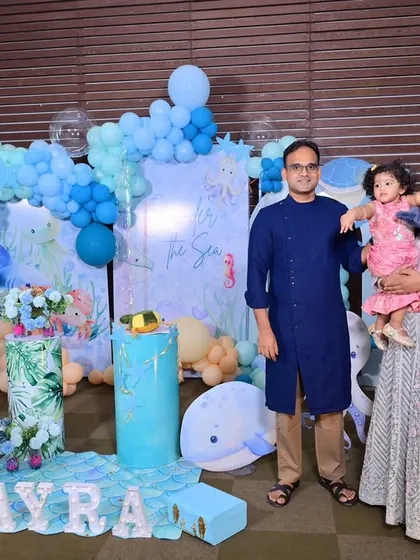 Capturing a happy family moment at their daughter Ayra's 'One-der the Sea' themed first birthday. Seeing my clients enjoy the spaces I create is the best part of my job. I design my decor to be the perfect backdrop for these precious memories.