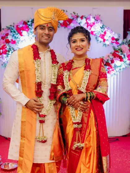 A classic wedding portrait of the beautiful couple against the stage backdrop.