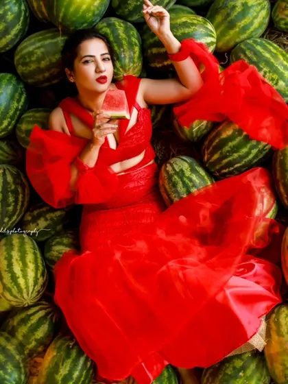A creative and vibrant summer-themed shoot with an actress in a red outfit surrounded by watermelons. This series is playful and colorful, perfect for a brand campaign or a unique portfolio piece.
