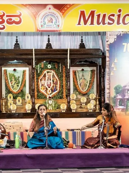 The full ensemble on stage at the Ramotsava music festival. The combination of vocals, violin, mridangam, and tabla creates the classic, pure sound of a Carnatic concert.