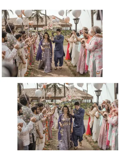 The couple's grand entrance through a tunnel of cheering guests at their Mehndi party.