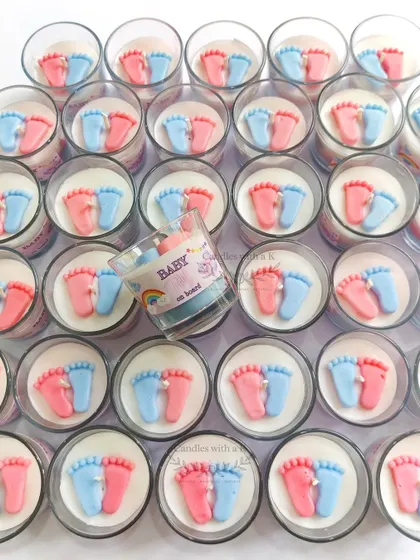 An overhead shot of 30 ocean-scented baby feet candles, showcasing the consistent quality and adorable design across a bulk order for a baby shower.
