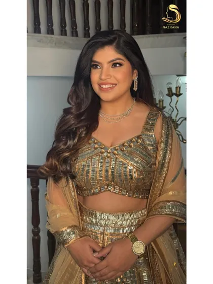 Soft, voluminous curls to match her forever glow. This is a perfect hairstyle for an engagement or reception, creating a look that is both glamorous and romantic.
