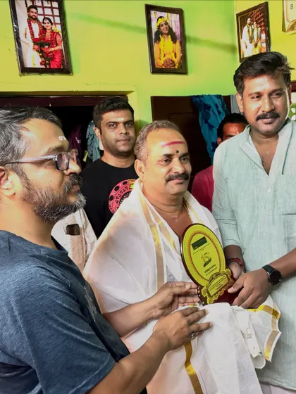 Presenting a token of our respect to our visiting guru during our 15th-anniversary 'Guruvandanam' ceremony. Their wisdom is invaluable to our academy.