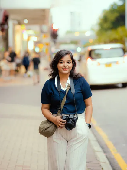 A portrait taken on a Hong Kong street. The soft, blurred background helps the subject stand out, a technique I often use in my travel films and photos.