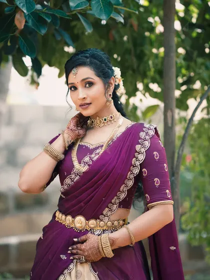 A beautiful client portrait showcasing her festive look for Diwali and her engagement, with her mehendi visible.