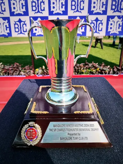 The Sir Charles Todhunter Memorial Cup, a tall and elegant silver trophy presented during the Winter Meeting.