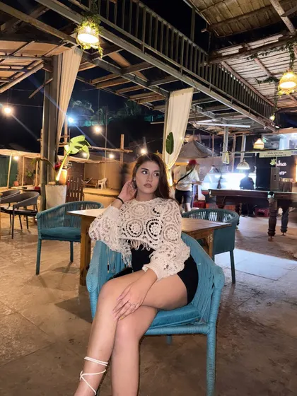 A candid shot at a beach shack in Goa, enjoying the late-night vibes in a crochet top and black skirt.