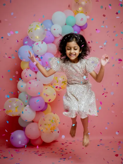 The pure joy of turning five. A confetti-filled studio session is a fantastic way to let their energetic personality shine.