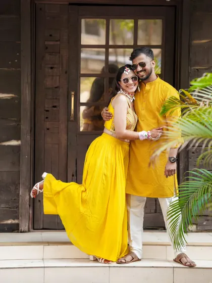 A playful and happy portrait of the couple during their Haldi festivities.