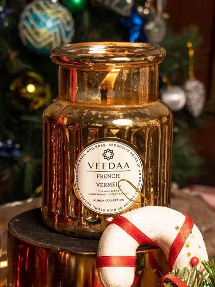 Bling up your holiday decor with our metallic crown jars. This French Vermeil candle in a stunning gold jar adds a touch of glamour and a beautiful fragrance to your festive setup.