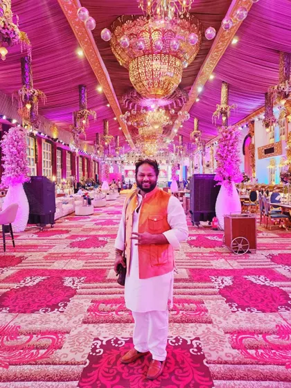 At a devotional program in a beautifully decorated venue. I am available for large-scale religious events and provide a professional musical experience.